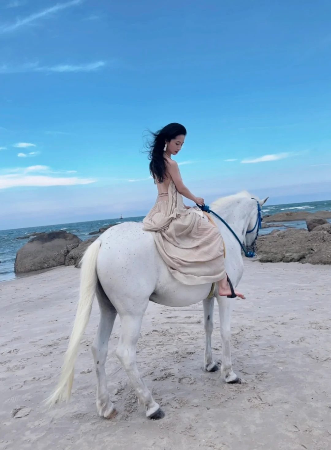 Hua Hin-Girls riding horses on Hua Hin Beach, must choose tall white