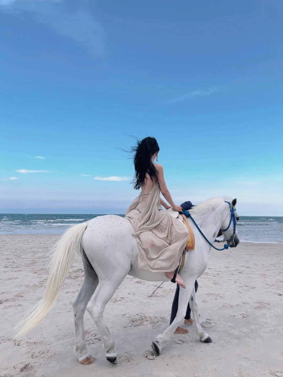 Hua Hin-Girls riding horses on Hua Hin Beach, must choose tall white