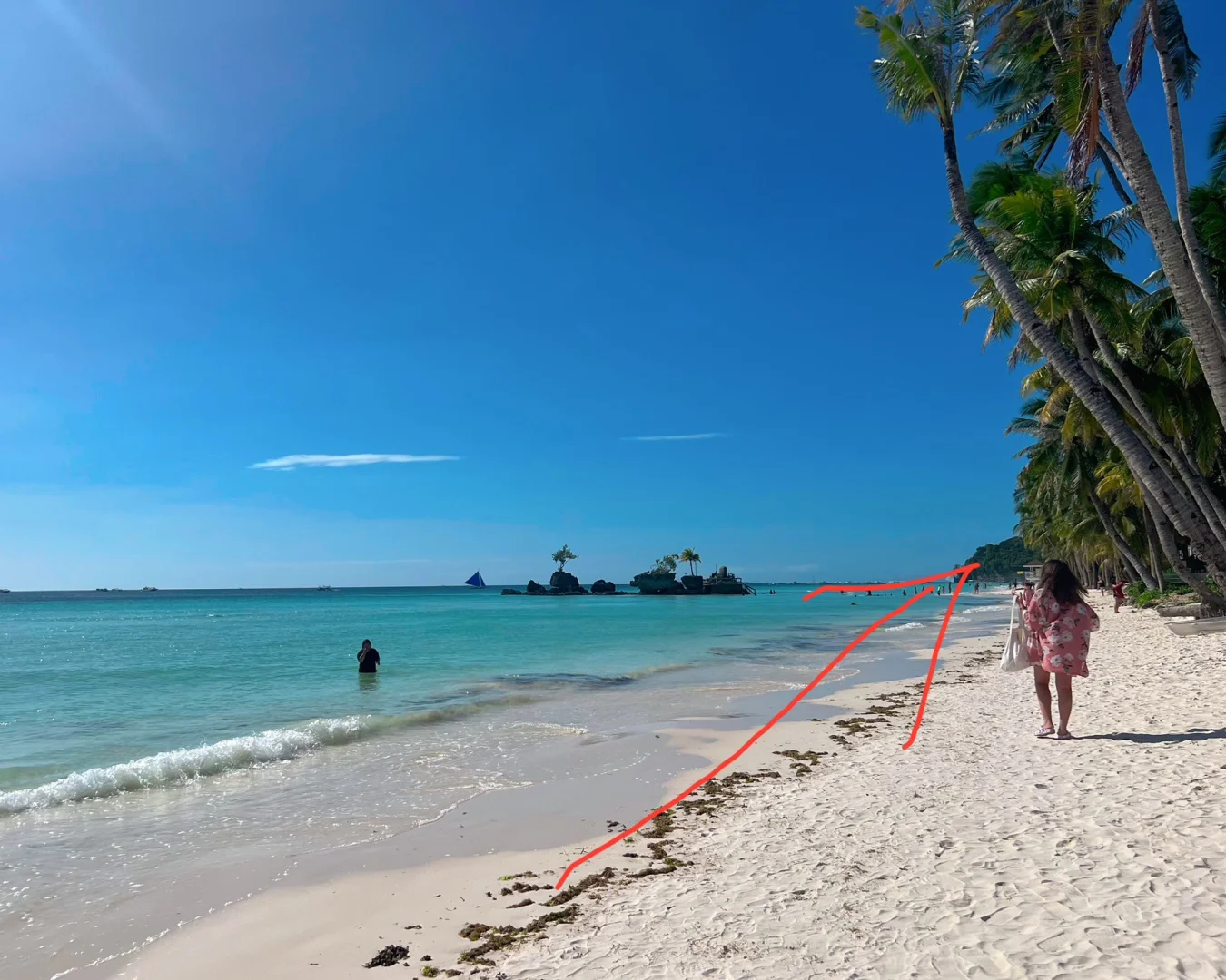 Boracay-Diniwid Beach, a cliff at the end of the white beach, where locals will help you take photos