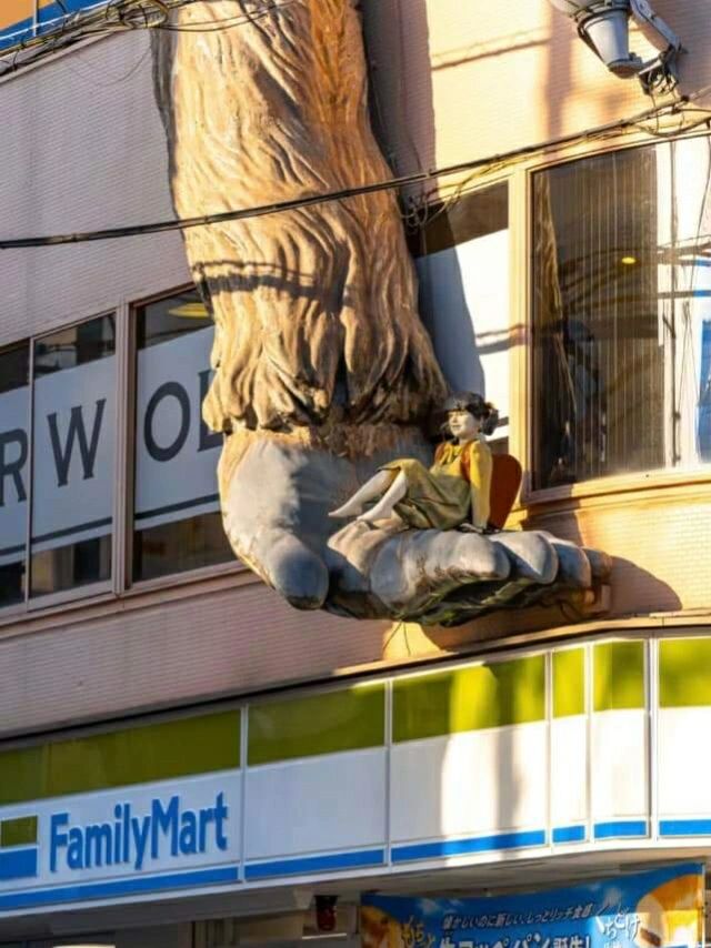 Tokyo-A giant gorilla reaches down from the top of a three-story building at Sangenjaya in Tokyo