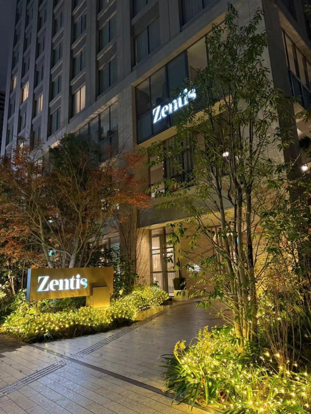 Osaka-Zentis Hotel in Osaka, Japan, with a log-style decoration and a terrace surrounded by green plants