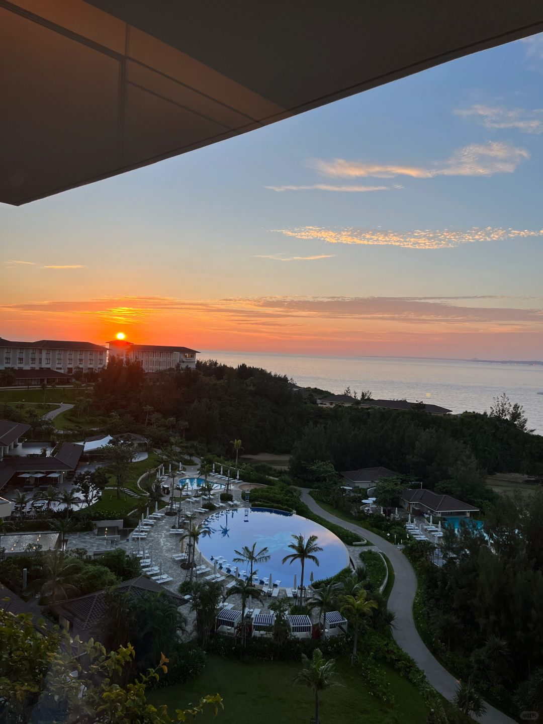 Okinawa-Halekulani Okinawa, a luxury resort in Okinawa, Japan, with staff bending over and smiling