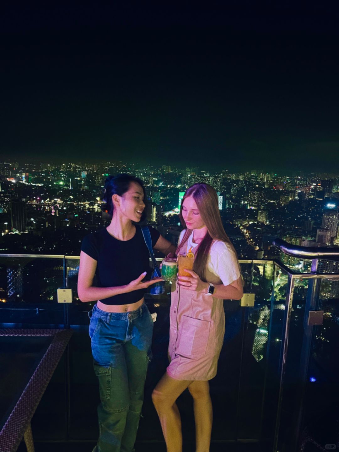 Hanoi-Top Of Hanoi Bar, the highest sky-high open-air bar in Hanoi, 2 girls drinking together