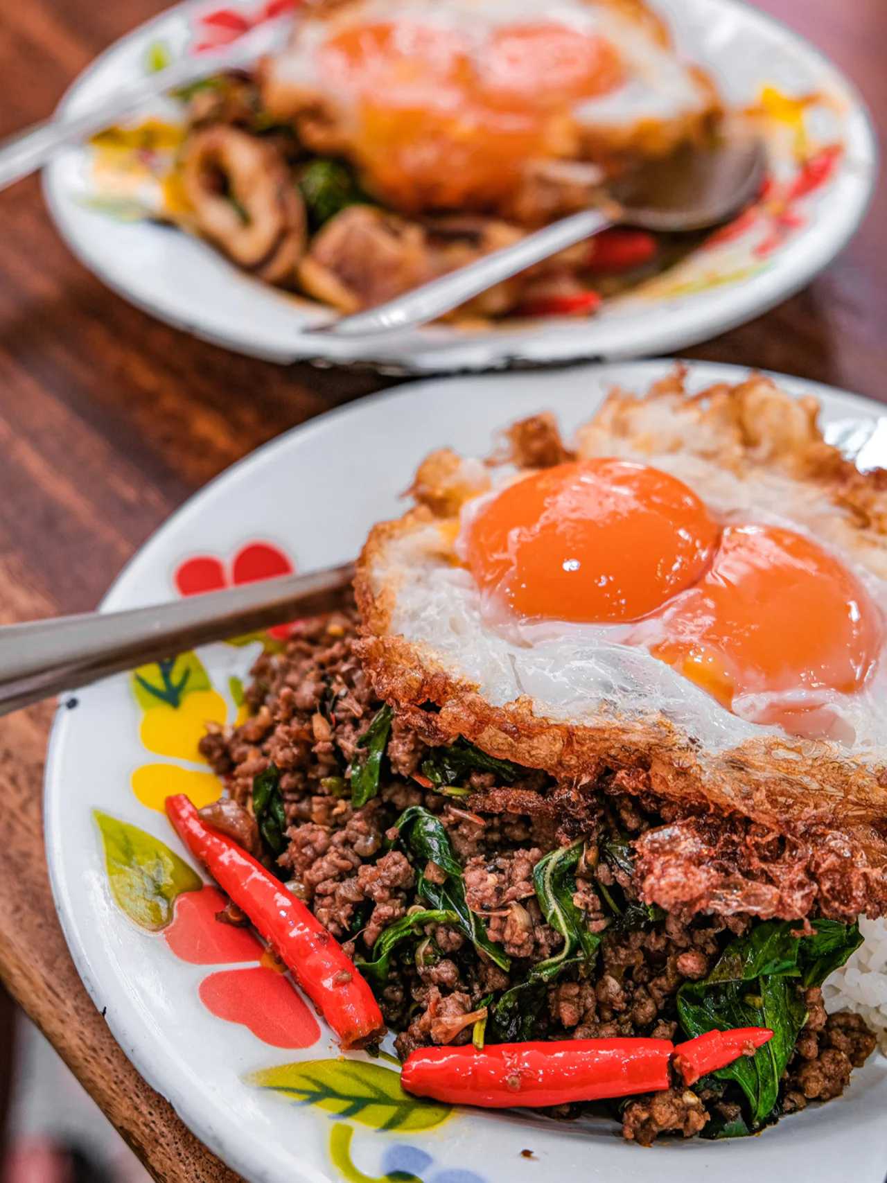 Bangkok-Phed Mark Wiens makes fried rice, and he always orders two of them, crispy and juicy.