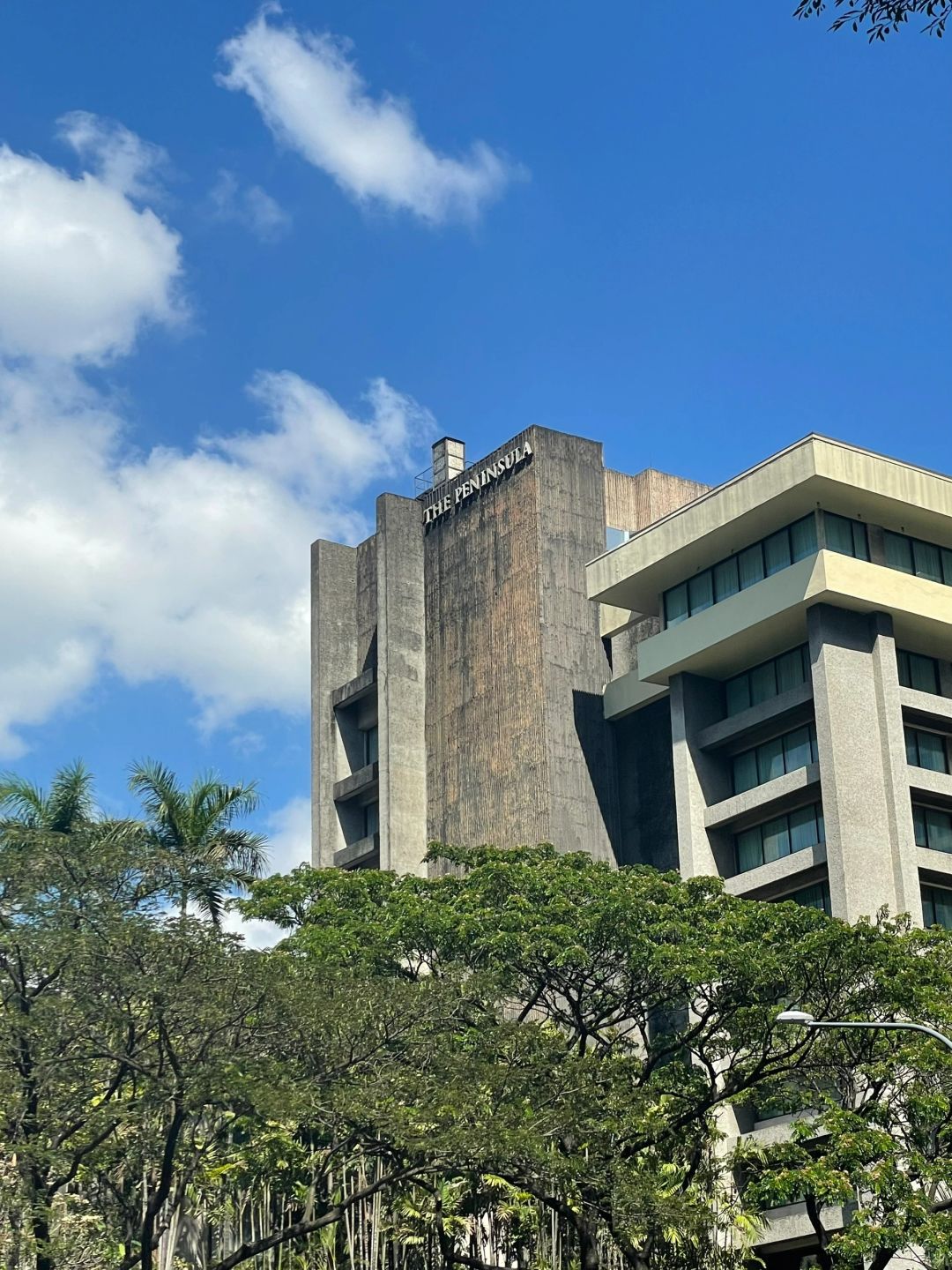 Manila/Luzon-Philippines, Brutalist architectural masterpiece cement style, The Peninsula Manila