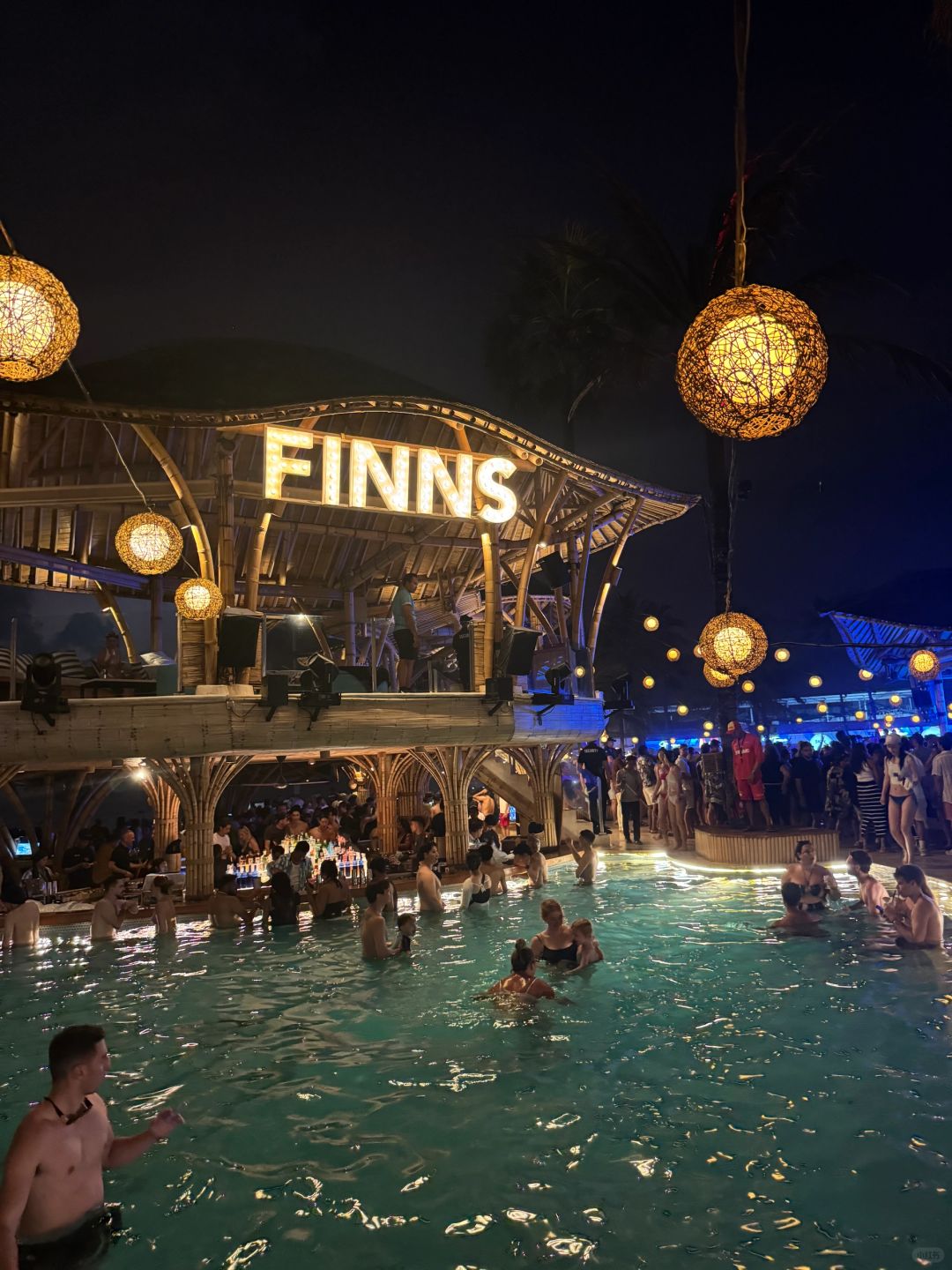 Bali-Finns, dancing at Bali's largest floating sea bar, touching the handsome guy's chest muscles