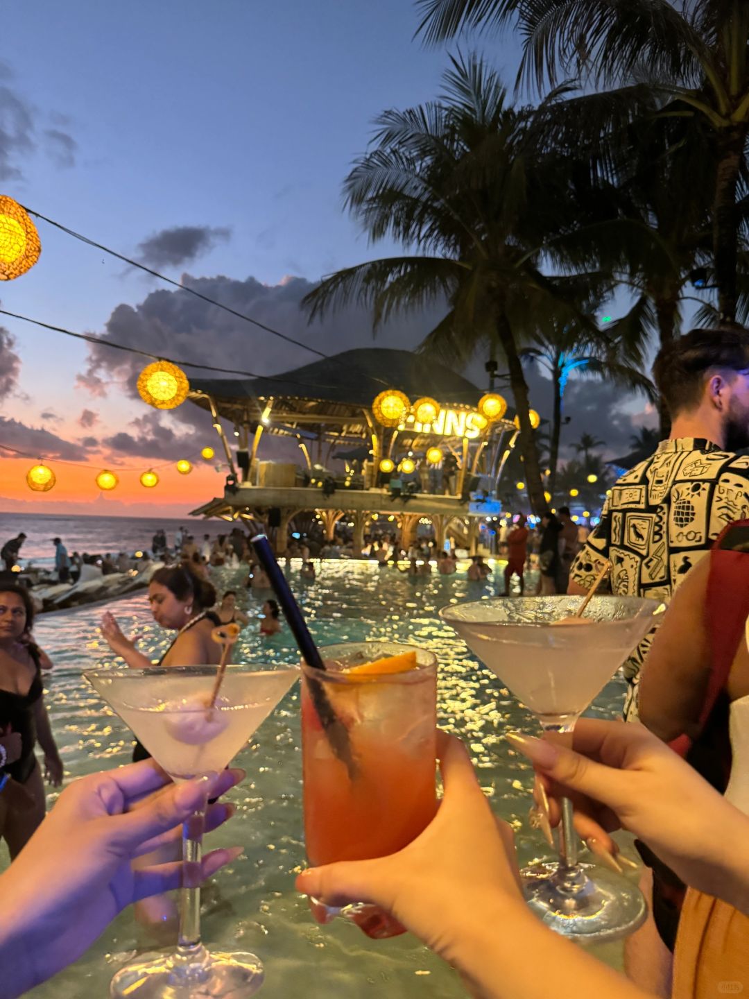 Bali-Finns, dancing at Bali's largest floating sea bar, touching the handsome guy's chest muscles