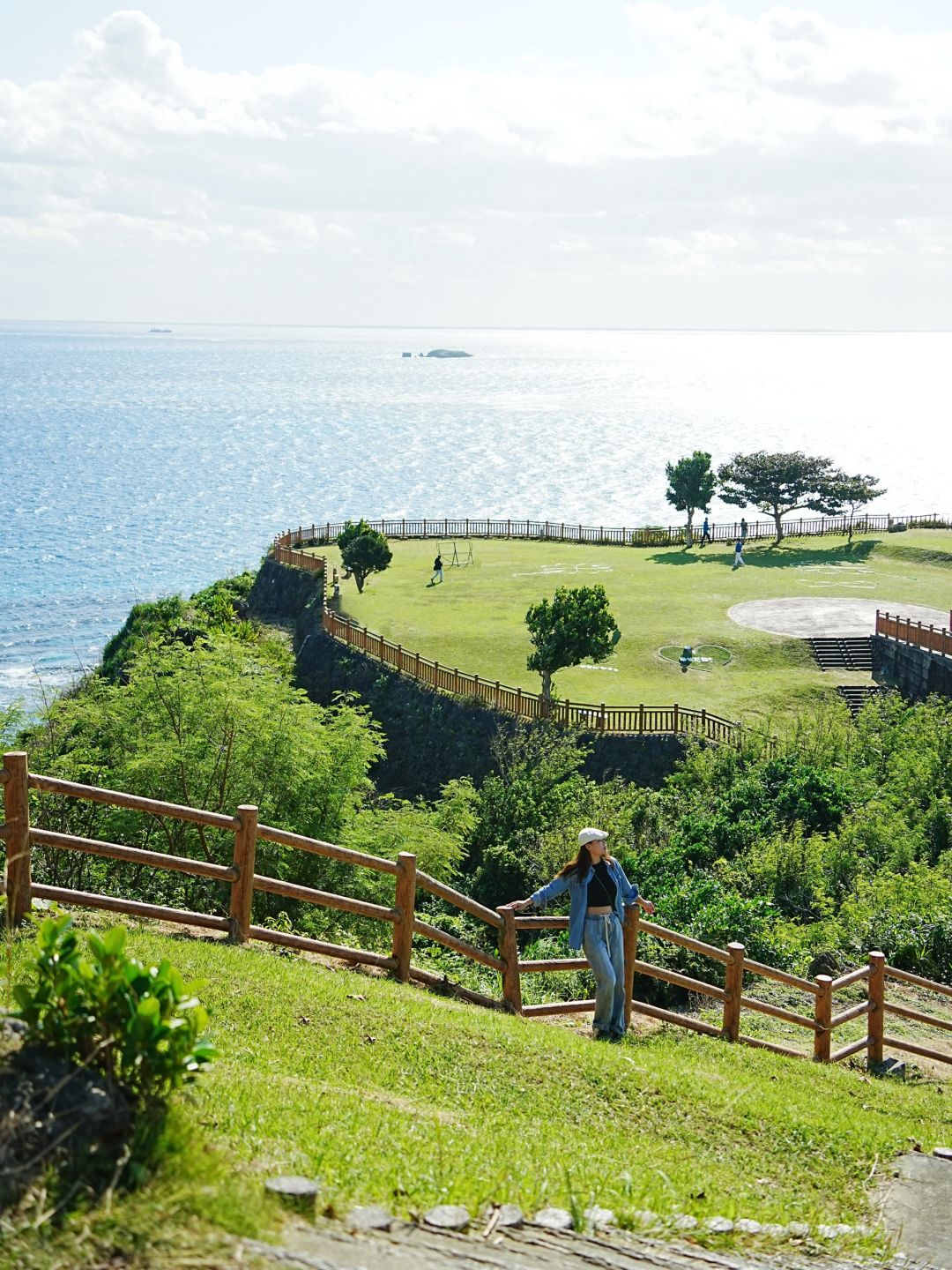 Okinawa-Beautiful Chinian Cape with turbulent waves and the distant sheep