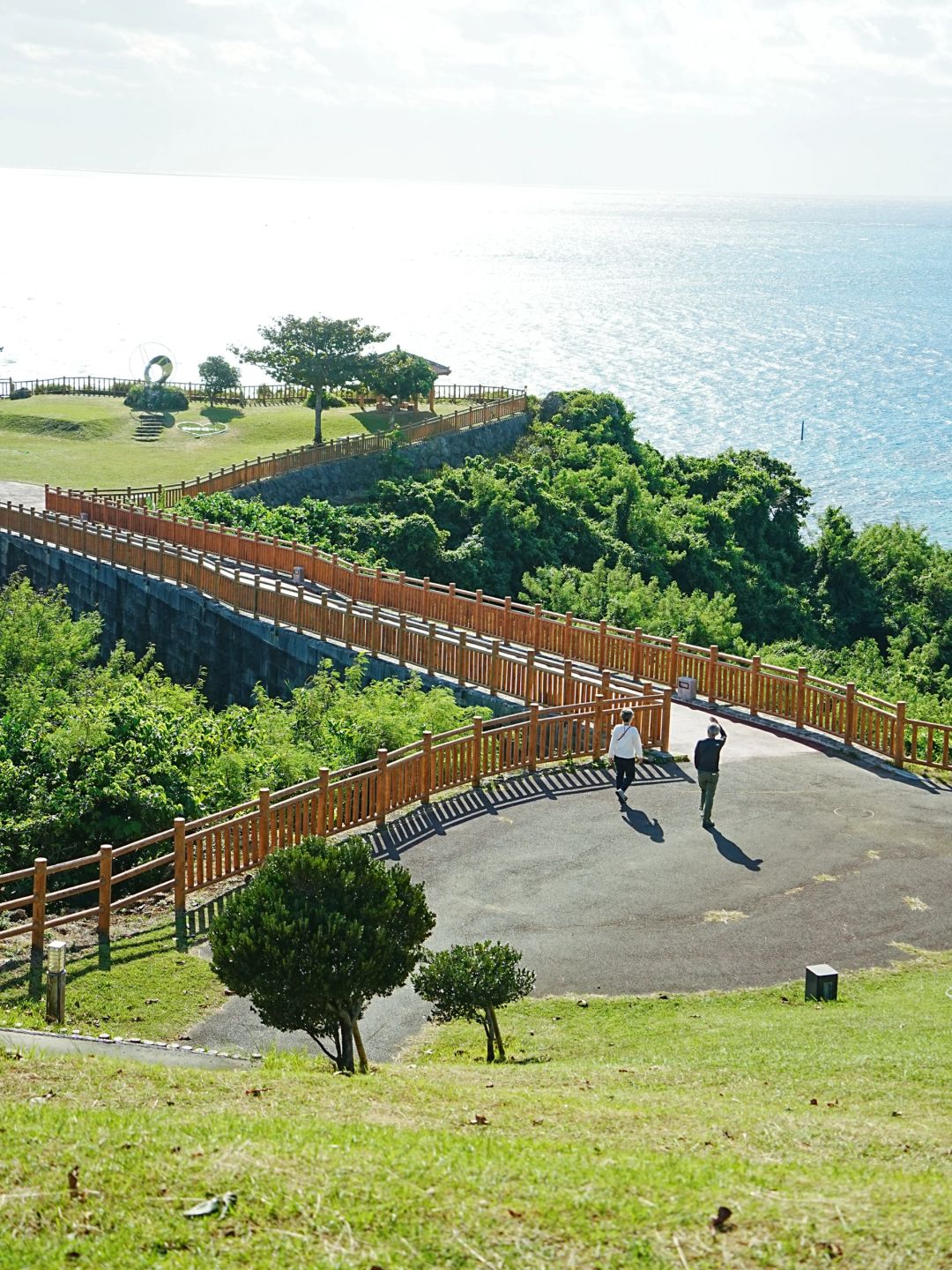 Okinawa-Beautiful Chinian Cape with turbulent waves and the distant sheep