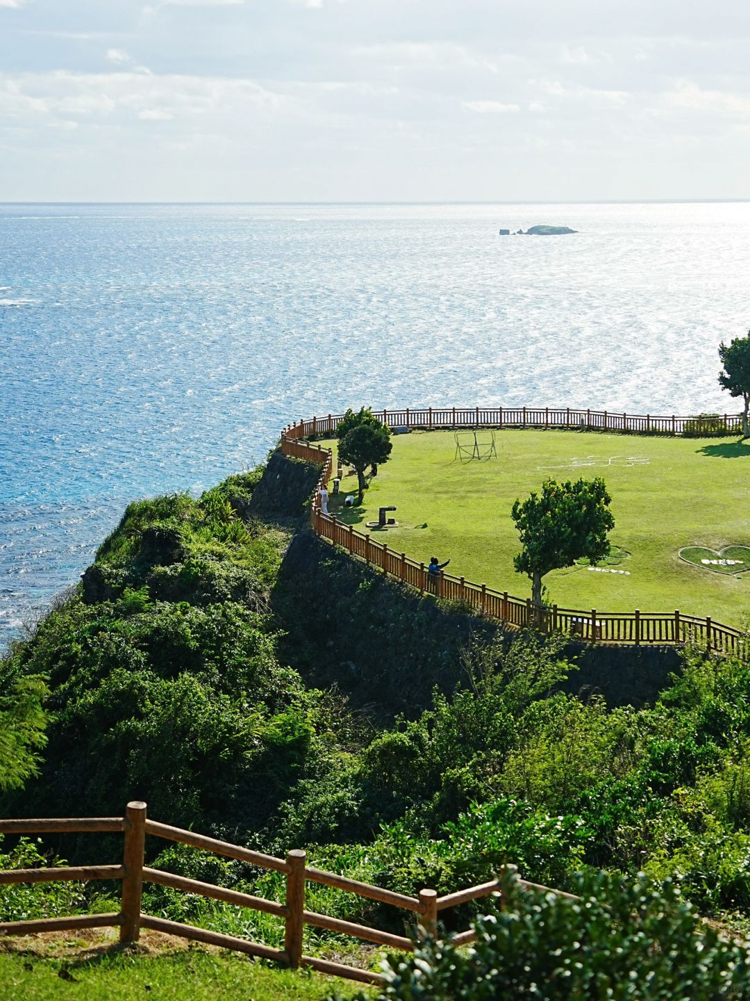 Okinawa-Beautiful Chinian Cape with turbulent waves and the distant sheep