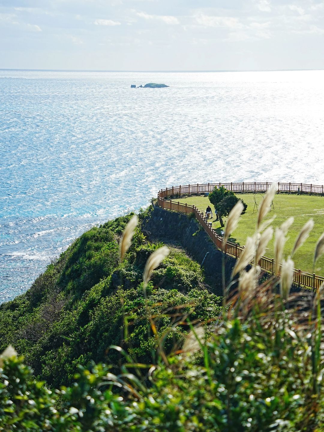 Okinawa-Beautiful Chinian Cape with turbulent waves and the distant sheep