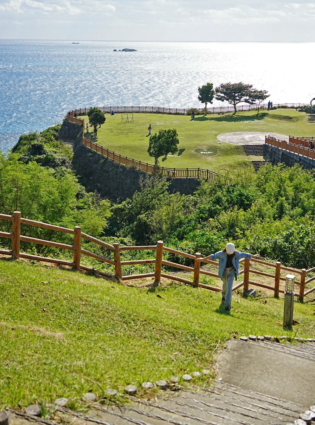 Okinawa-Beautiful Chinian Cape with turbulent waves and the distant sheep