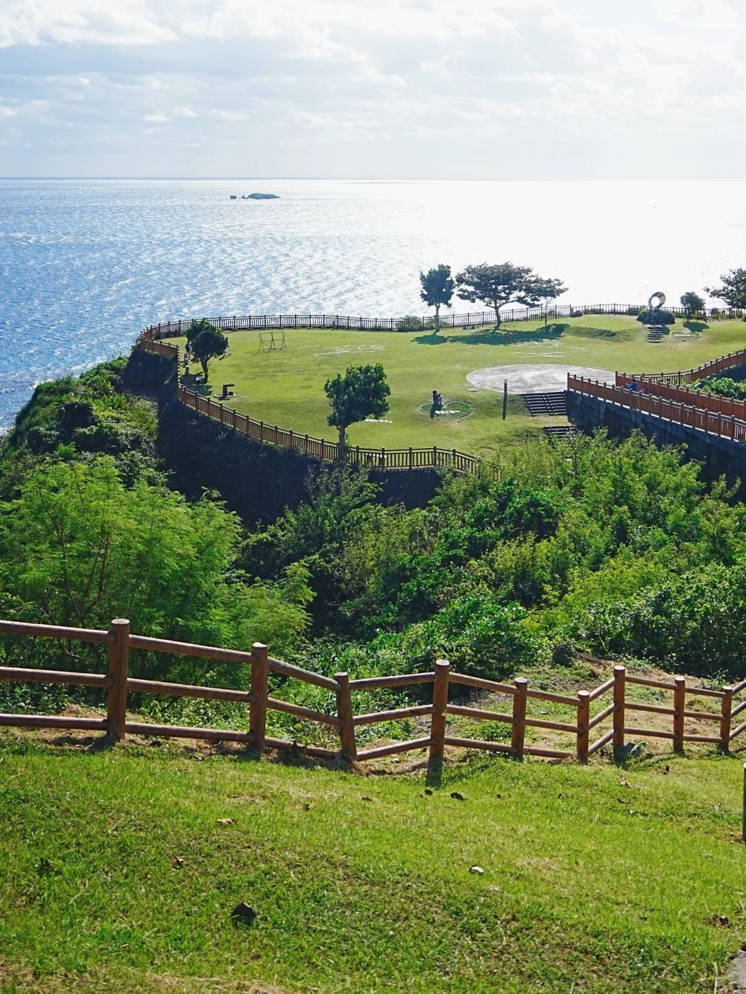 Okinawa-Beautiful Chinian Cape with turbulent waves and the distant sheep