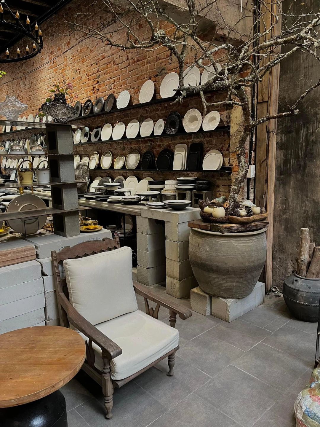 Hanoi-May kitchenware, cafe with garden space, green trees and wooden decoration in Hanoi