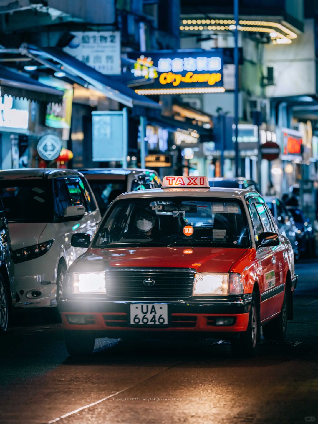 Hong kong-Neon lights and taxis on Portland Street at night, Hong Kong-style architecture and life