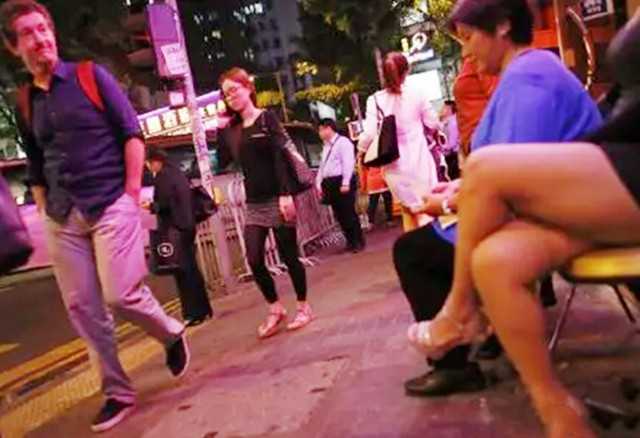 Hong kong-The history and present of Hong Kong's Wan Chai "red light district", with nightclubs and neon lights all over the "brothels"