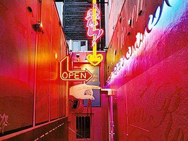 Hong kong-The history and present of Hong Kong's Wan Chai "red light district", with nightclubs and neon lights all over the "brothels"