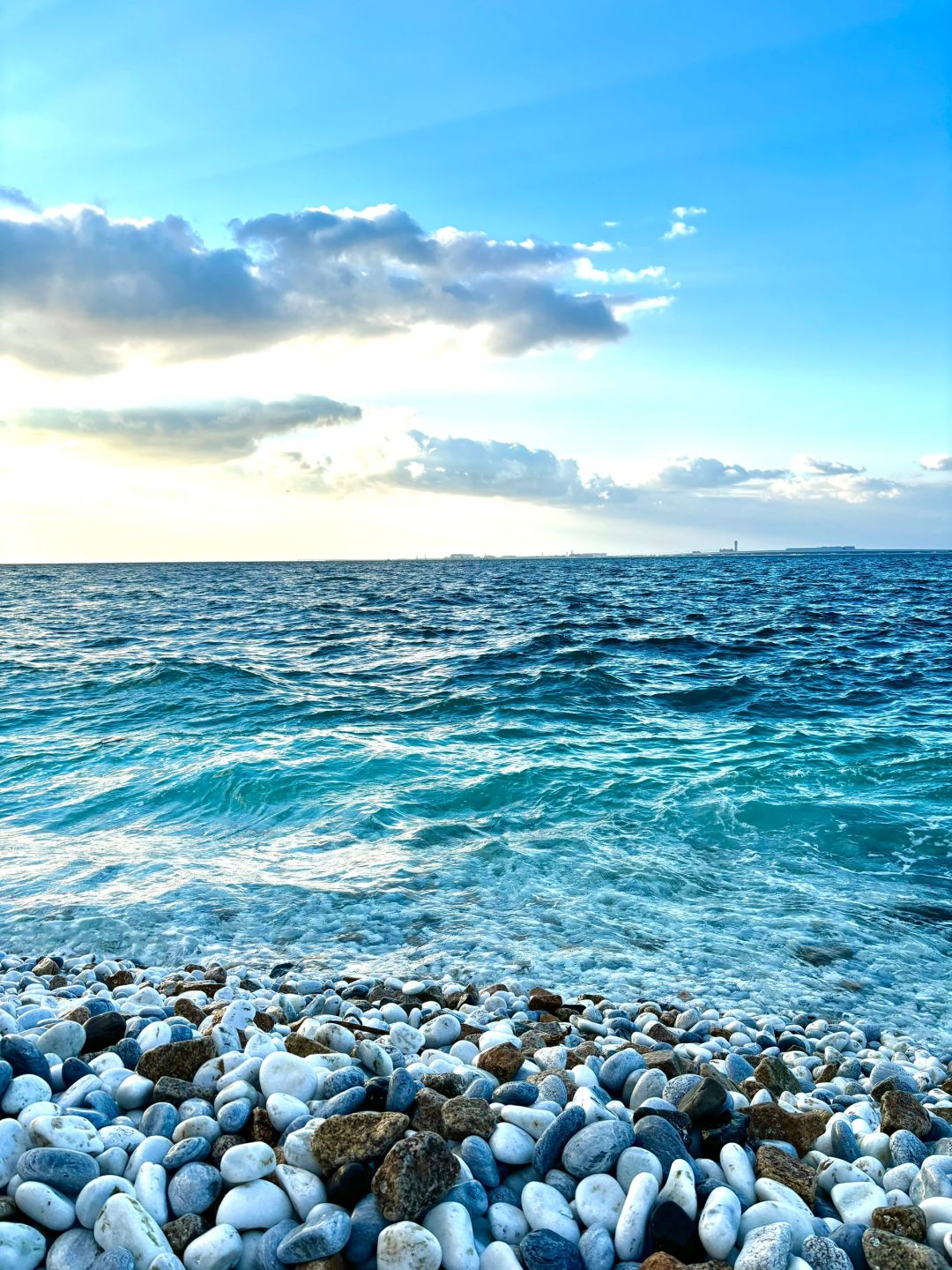 Osaka-Rinku Town is only one subway station away from Kansai Airport, and the jelly-blue sea