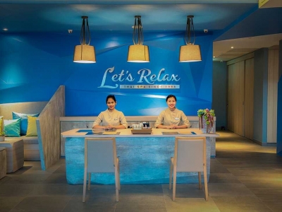 Embrace the Calm at Let’s Relax Spa, blending grey rocks and turquoise waters