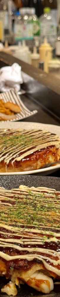 Osaka Teppanyaki restaurant Doraju, the aroma of food fills the warm light of the store