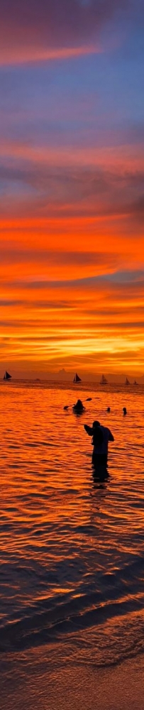 The beautiful sunset at the beach in Boracay at 5 pm. No filter is needed to enjoy the red sunset