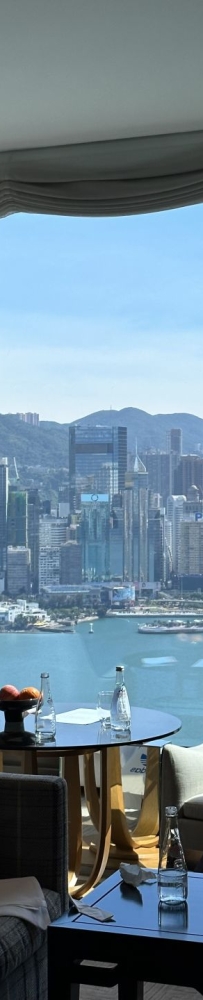 Sunny day the Rosewood Hotel Hong Kong, you can see Victoria Harbour by opening the curtains