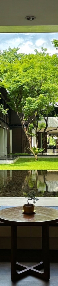 Anantara Chiang Mai Hotel Resort, designed by Kerry Hill, sunbathing and reading by the pool